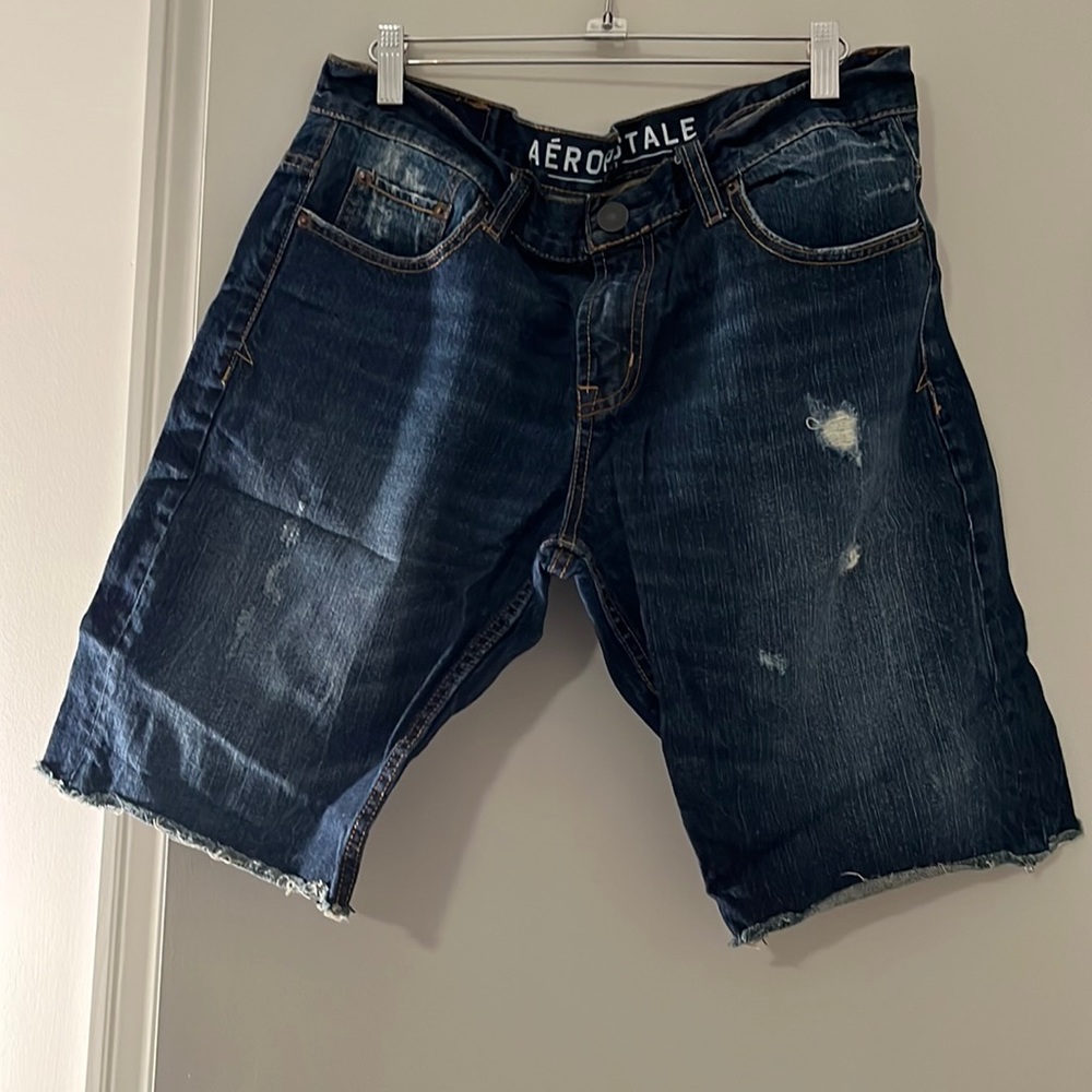Aeropostale men’s cut off distressed denim shorts. Size 34. Color dark washed.